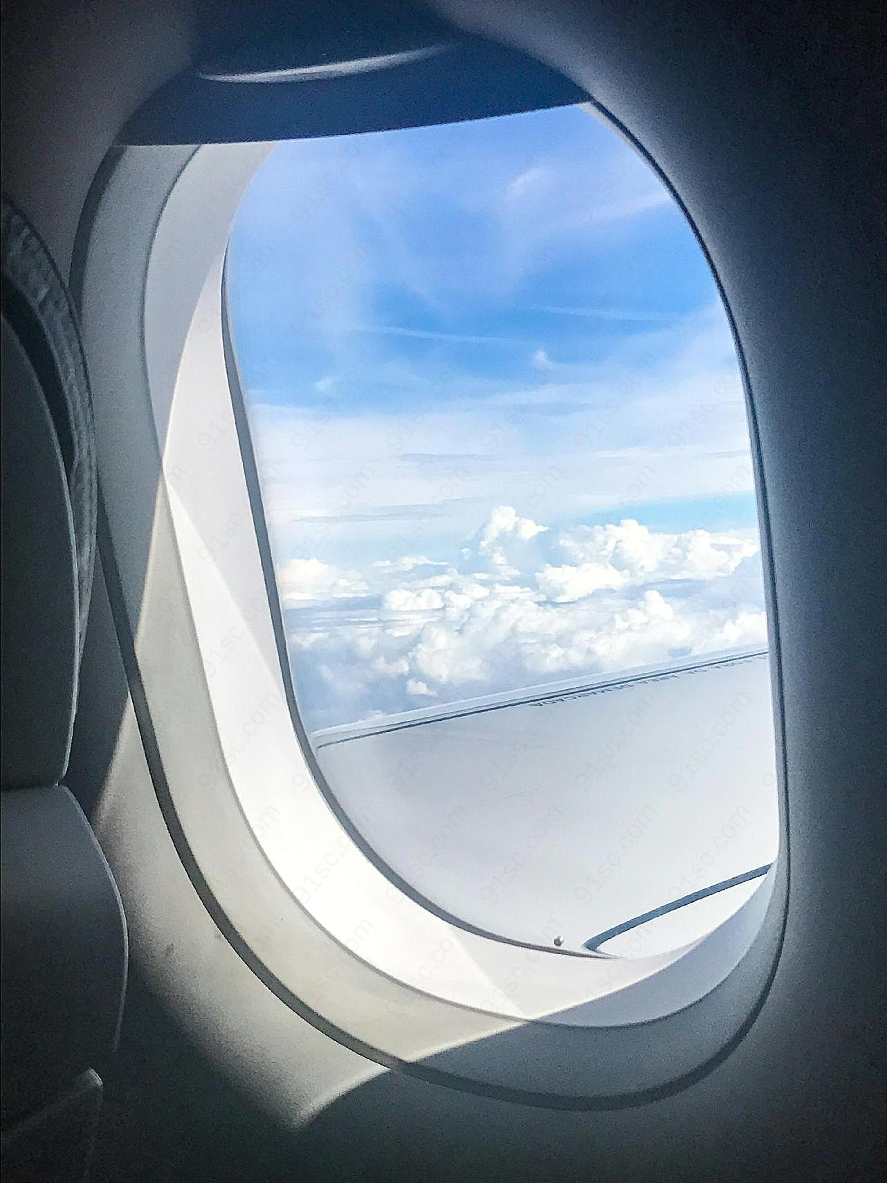 飞机上的窗户外风景图片摄影